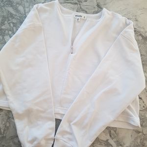 Cropped white long sleeve top
